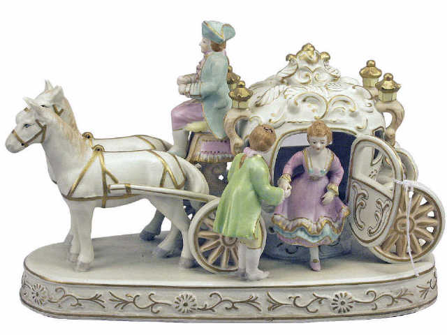 Appraisal: Hand painted porcelain figurine of carriage with riding passengers measuring