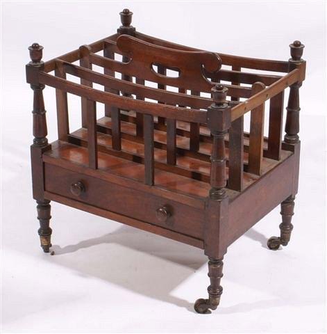 Appraisal: A th century mahogany Canterbury with turned outside supports over