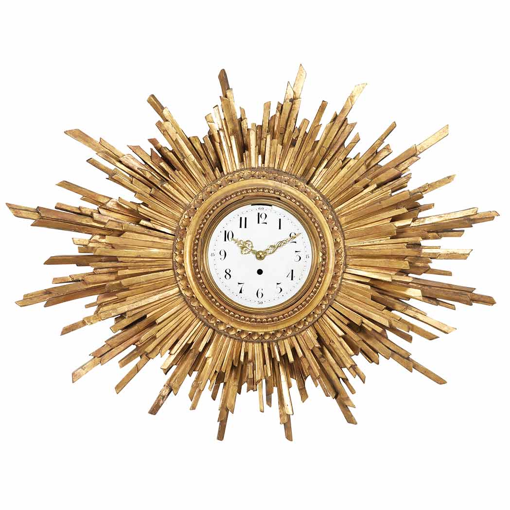 Appraisal: Continental Giltwood Sunburst Clock The white enamel face with a