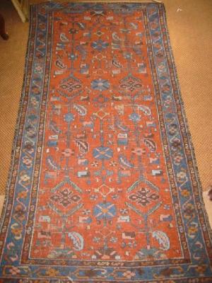 Appraisal: A NORTH WEST PERSIAN RUG early th century the red