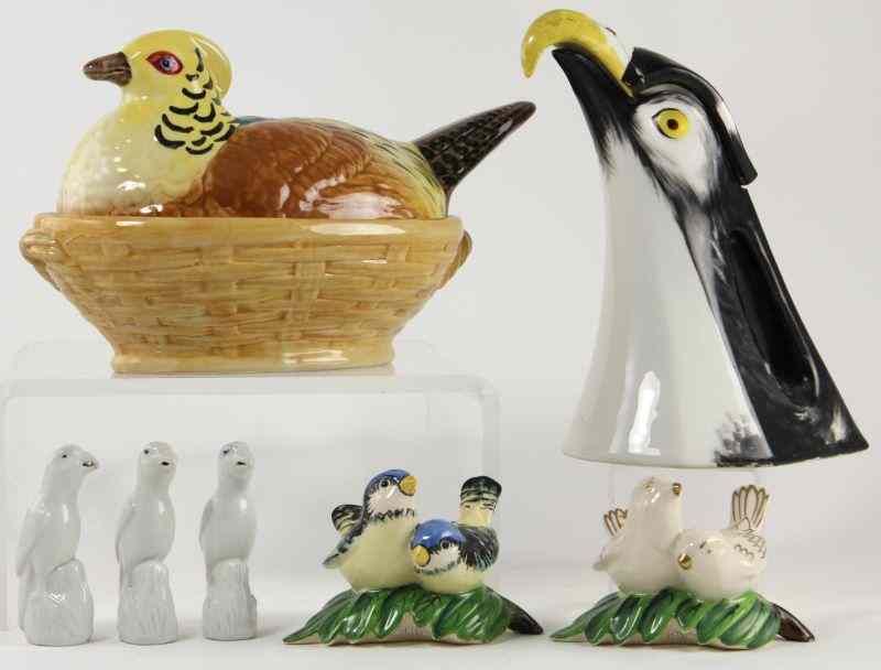 Appraisal: Seven Bird FiguresLimoges eagle form pitcher with lid repaired breaks