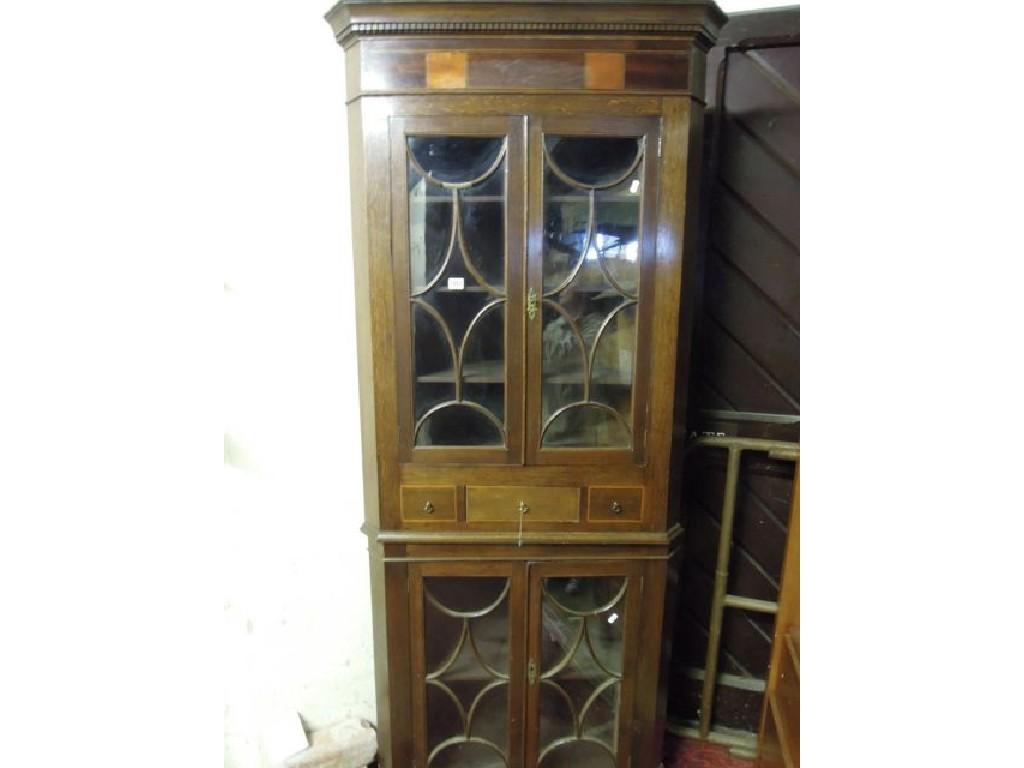 Appraisal: A th century oak freestanding two sectional corner cabinet the