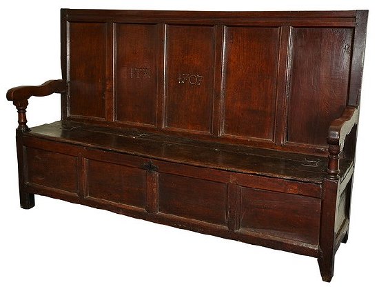 Appraisal: An early th Century oak settle with box seat and