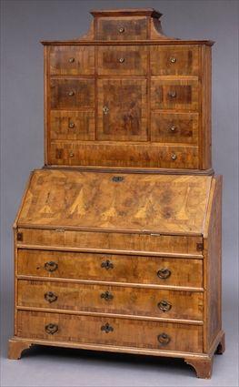 Appraisal: AUSTRIAN ROCOCO WALNUT-INLAID BUREAU BOOKCASE The shaped top above drawers