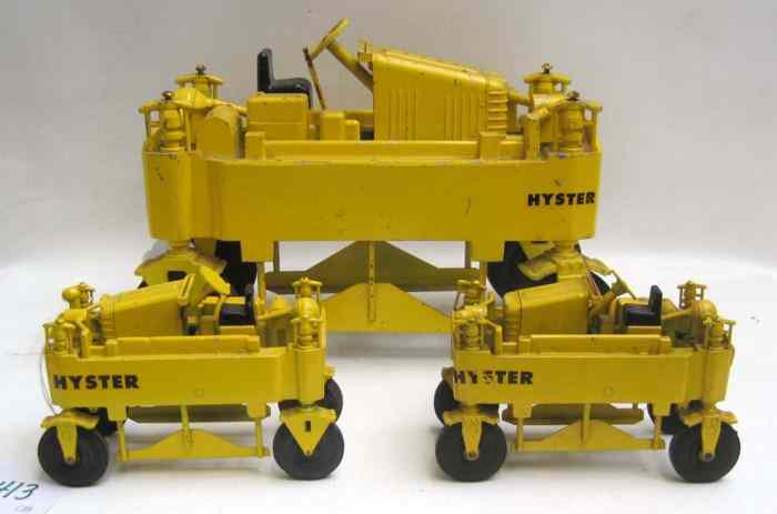 Appraisal: THREE HYSTER-DRUGE DIECAST METAL ''STRADDLE'' LUMBER CARRIERS two are small