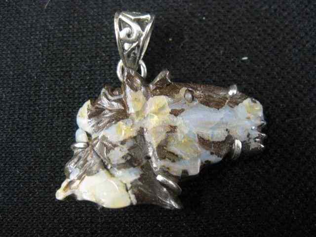 Appraisal: Carved Opal Horsehead Pendant in natural matrix in sterling silver