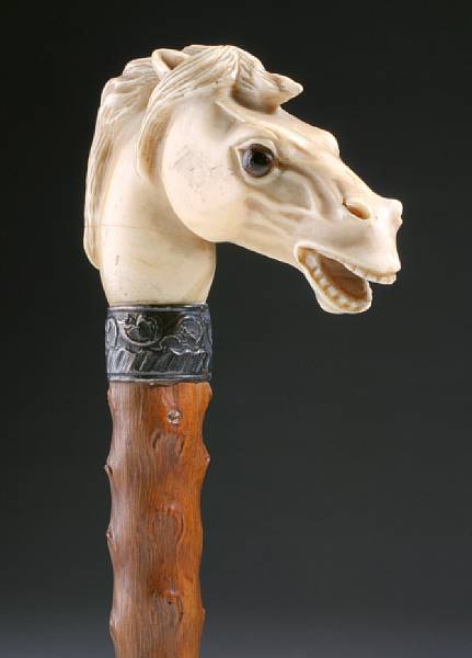 Appraisal: A Continental ivory mounted walking cane fourth quarter th century