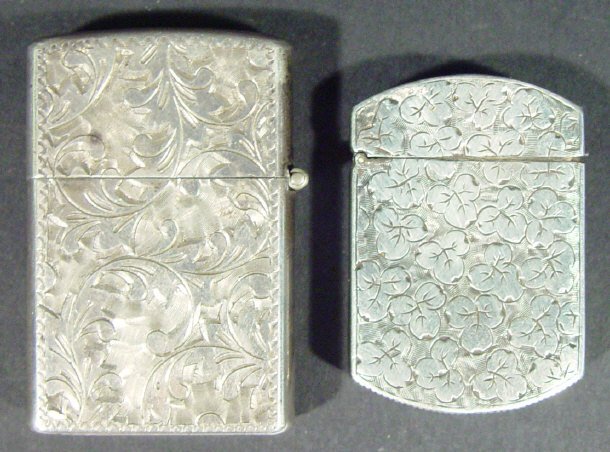 Appraisal: Sterling silver lighter the outer case chased with leaves together