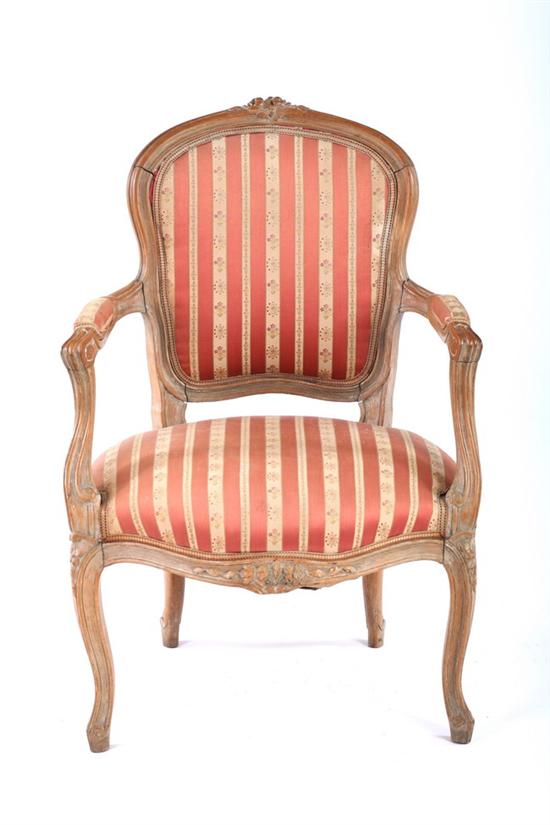 Appraisal: LOUIS XV STYLE CARVED FRUITWOOD FAUTEUILS th century Floral crest