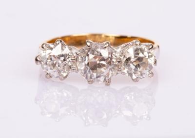 Appraisal: A diamond three-stone ring the three old brilliant cut stones