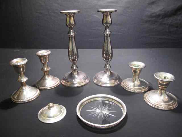 Appraisal: small sets of sterling candlesticks one glass sterling coaster and