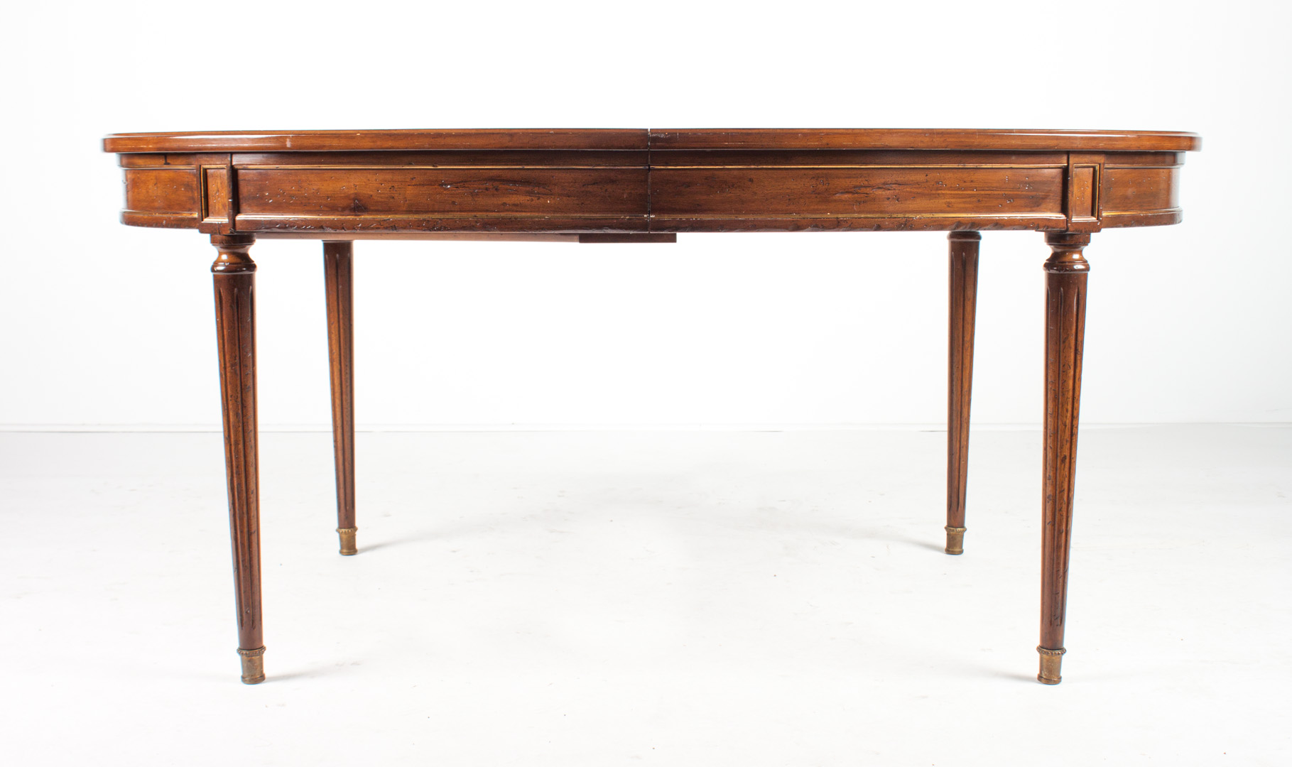 Appraisal: Louis XVI style walnut dining table with brass mounts on