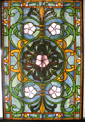 Appraisal: A STAINED AND LEADED GLASS WINDOW PANEL Centered with large