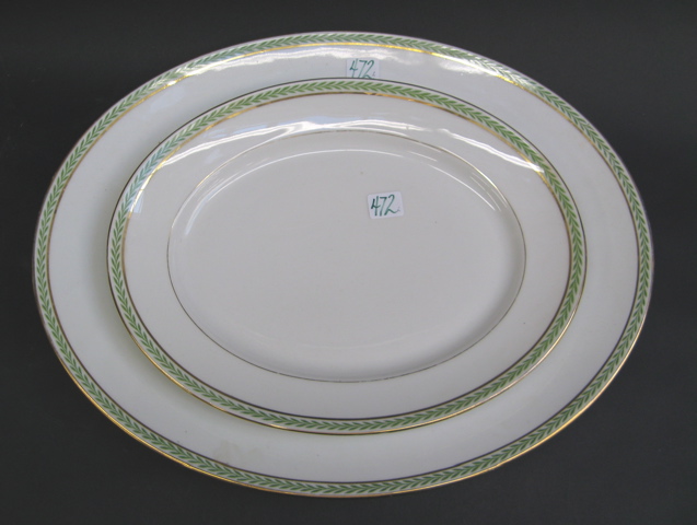 Appraisal: TWO LIMOGES FRANCE PORCELAIN MEAT PLATTERS banded with green leaves