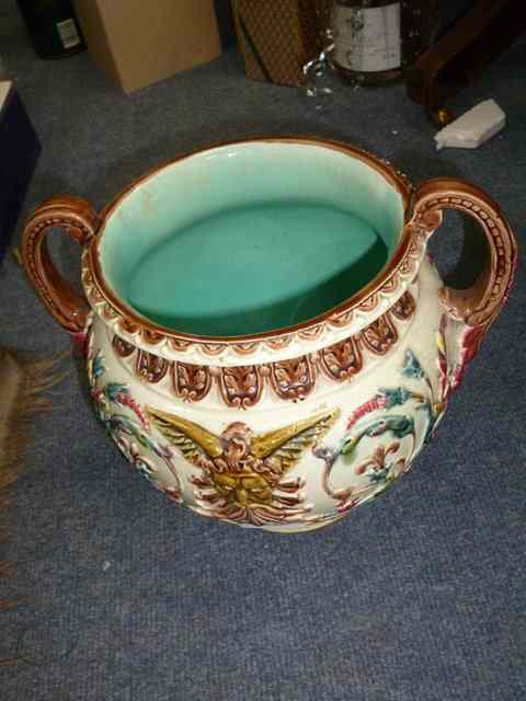 Appraisal: A MAJOLICA WARE TWO HANDLED URN decorated in relief with