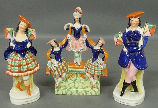 Appraisal: - Three Staffordshire figural groups c incl a male and