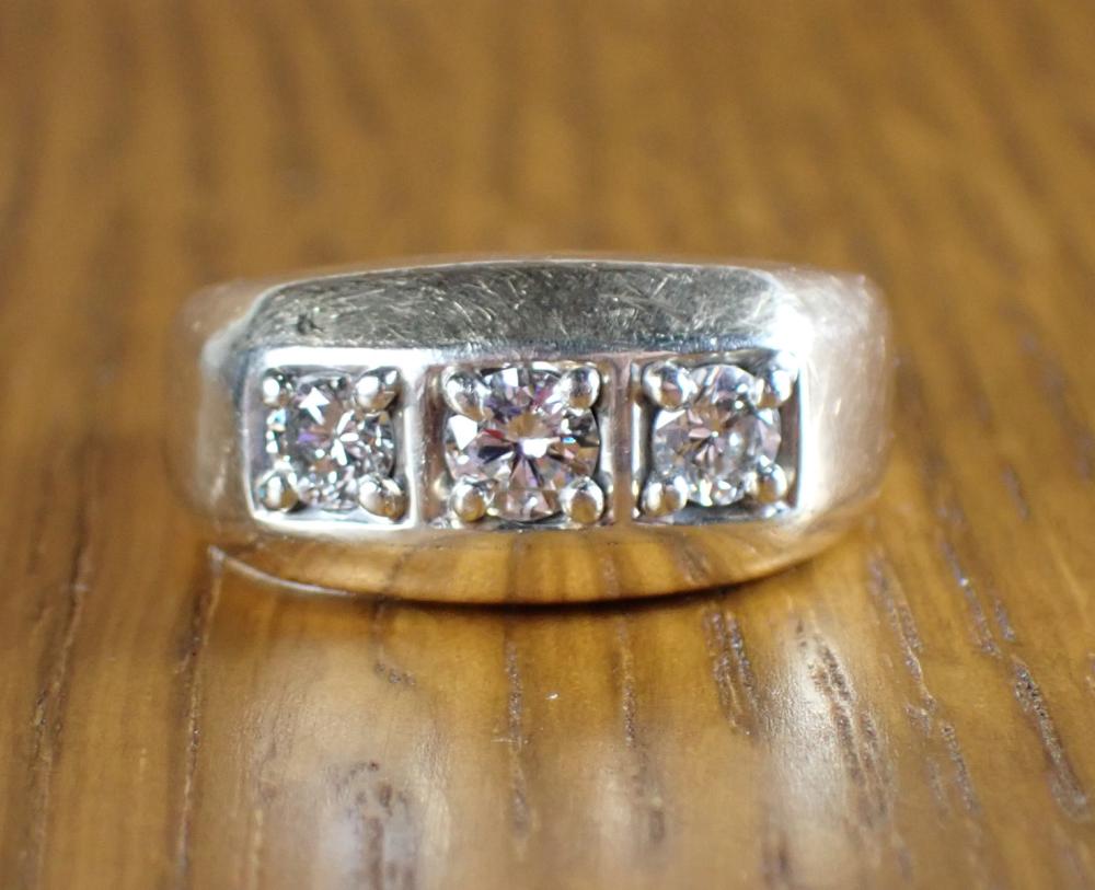 Appraisal: MAN'S DIAMOND AND FOURTEEN KARAT GOLD RING set with three