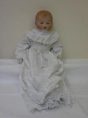 Appraisal: An Armand Marseille bisque head baby doll with blue glass