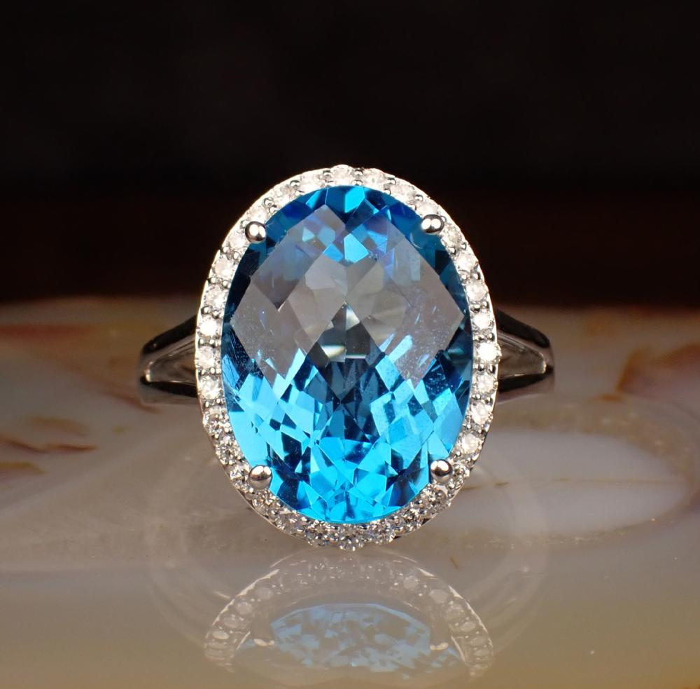 Appraisal: BLUE TOPAZ DIAMOND AND FOURTEEN KARAT GOLD RING The white