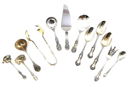 Appraisal: SILVER twelve pieces including eight sterling silver serving utensils three