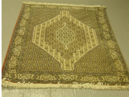 Appraisal: Senneh cream-ground Persian rug with main repeating geometric border and