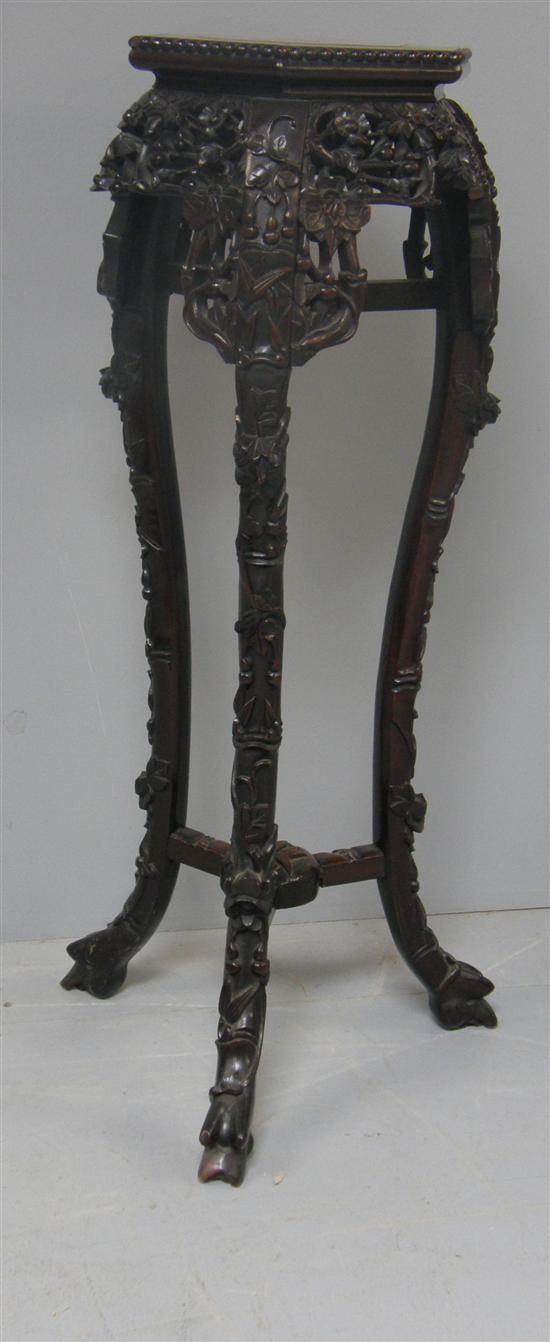 Appraisal: Chinese rosewood carved stand with pink marble top raised on