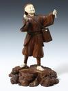 Appraisal: CARVED WOOD AND IVORY JAPANESE CABINET FIGURE - Large Single