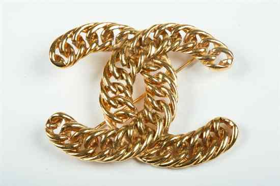 Appraisal: CHANEL GOLD TONE LOGO BROOCH