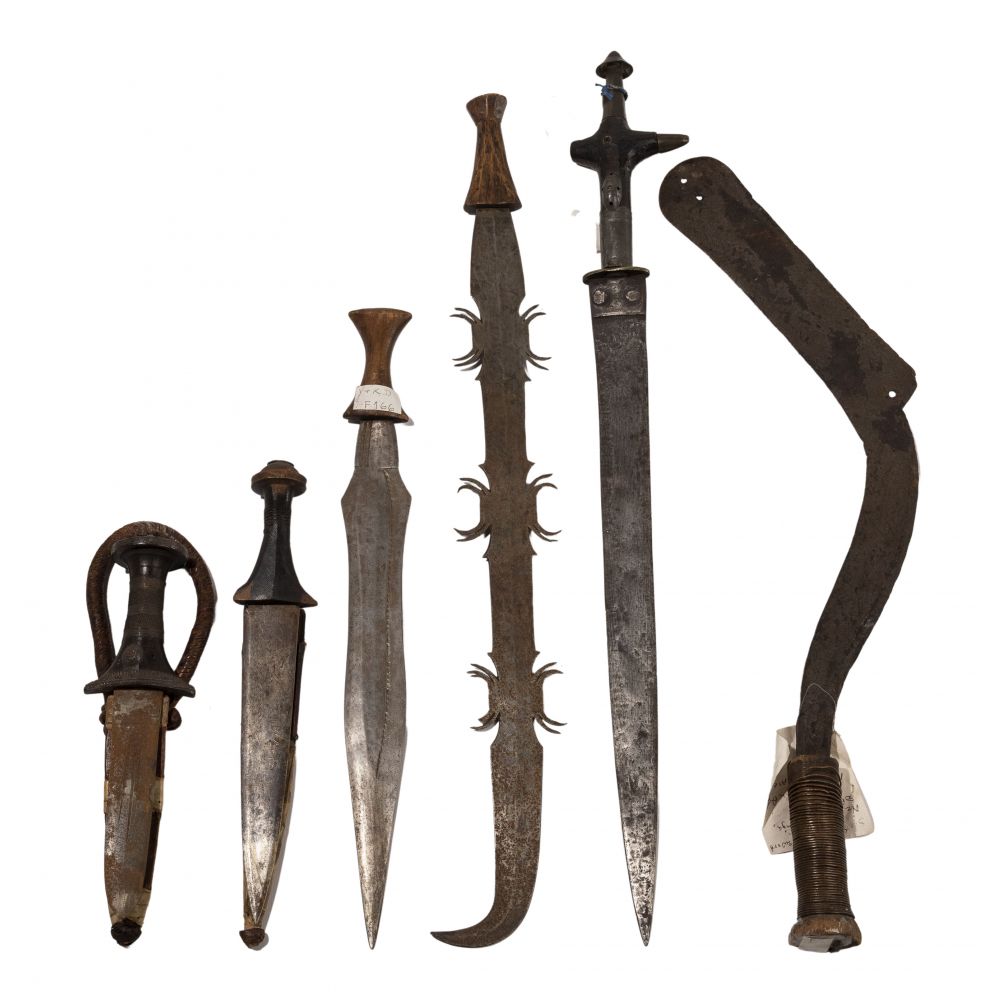 Appraisal: AFRICAN WEAPON ASSORTMENT items including Tuareg style takouba sword from