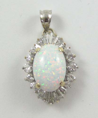 Appraisal: LAB CREATED OPAL AND FOURTEEN KARAT GOLD PENDANT with round-cut