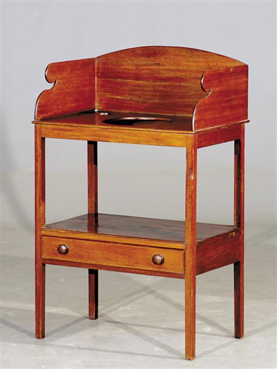 Appraisal: English mahogany washstand late th century three-quarter shaped backsplash enclosing