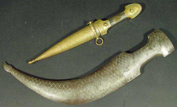 Appraisal: Two Middle Eastern daggers one with a silvered metal scabard