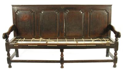 Appraisal: A George III oak quadruple panel back settle with brass