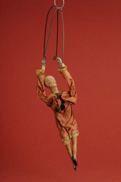 Appraisal: Clockwork Acrobat Toy Germany ca composition head arms and legs