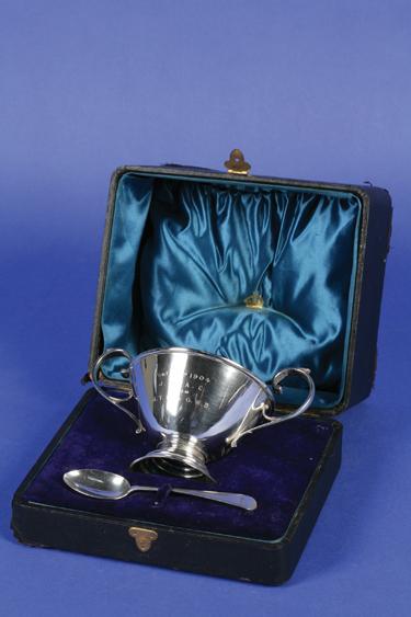 Appraisal: AN EDWARDIAN CHRISTENING BOWL AND SPOON the bowl of circular