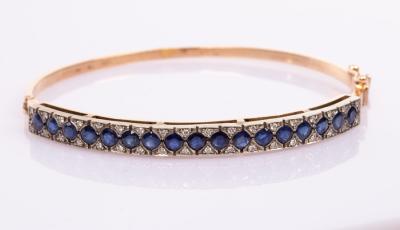 Appraisal: A sapphire and diamond hinged bangle set in ct yellow