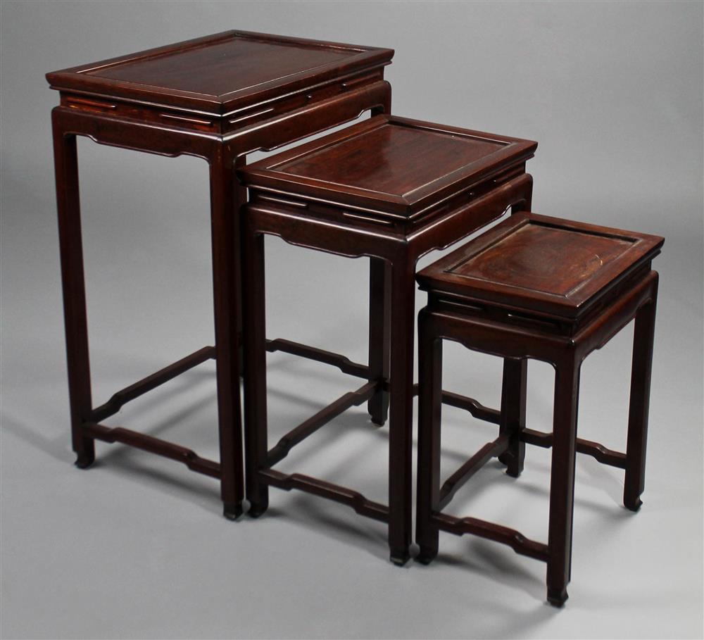 Appraisal: GROUP OF THREE ASIAN ROSEWOOD NESTING TABLES the largest being