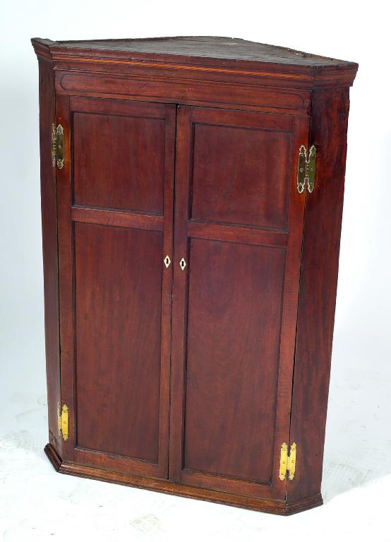 Appraisal: EARLY th CENTURY MAHOGANY HANGING CORNER CUPBOARD the frieze with