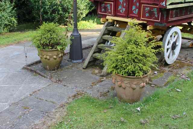 Appraisal: A GROUP OF FOUR COMPOSITE PLANTERS each decorated with a