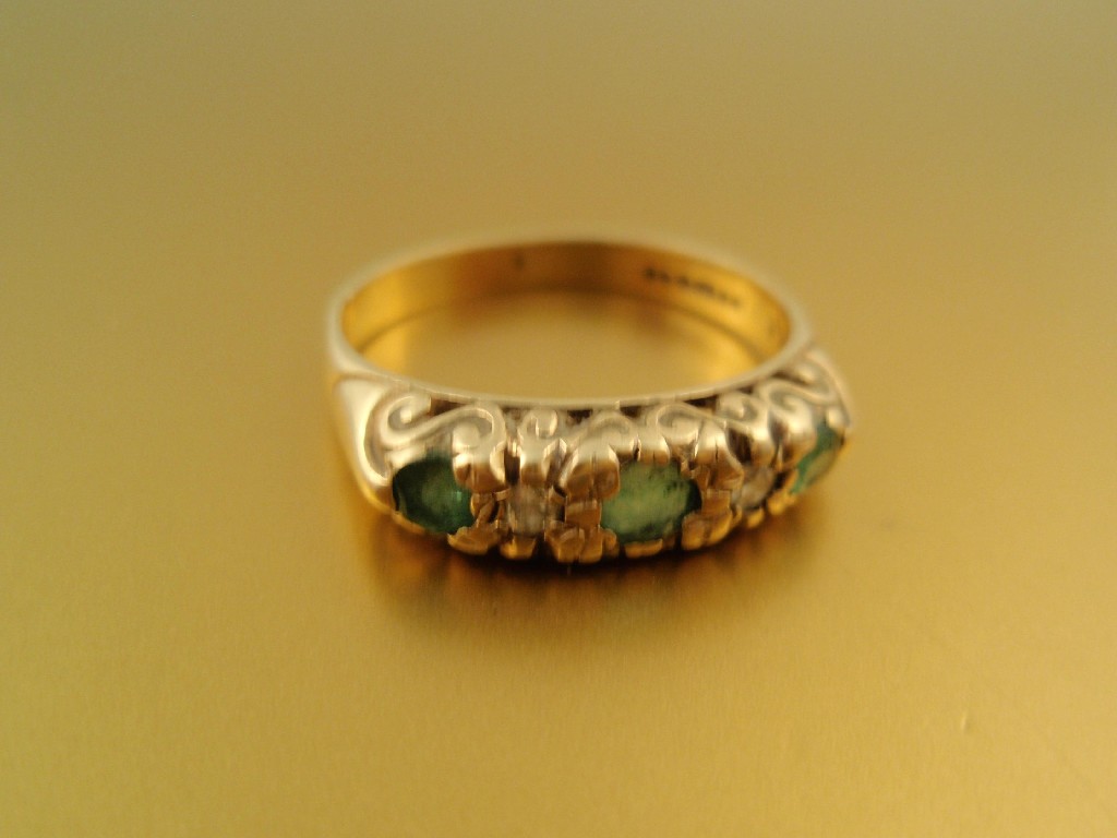 Appraisal: A ct gold dress ring set in line with three