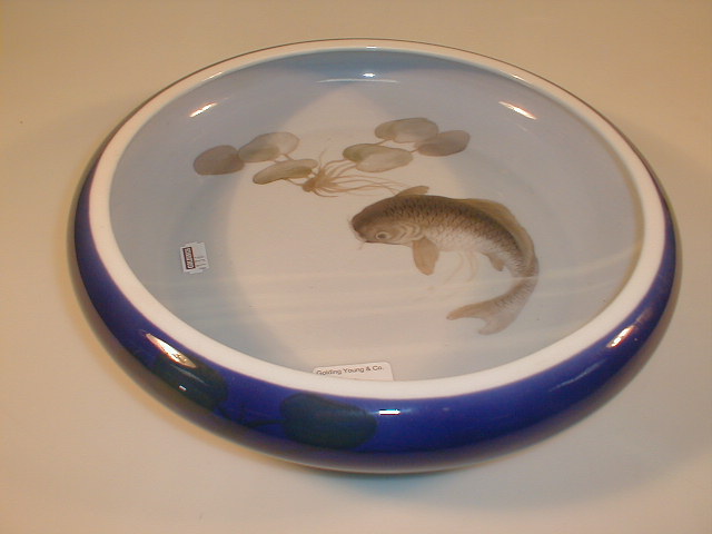 Appraisal: A Royal Copenhagen shallow bowl with carp and lily pad