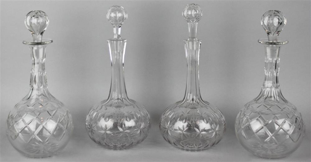 Appraisal: TWO PAIRS OF BOTTLE-SHAPED CUT GLASS DECANTERS including one pair