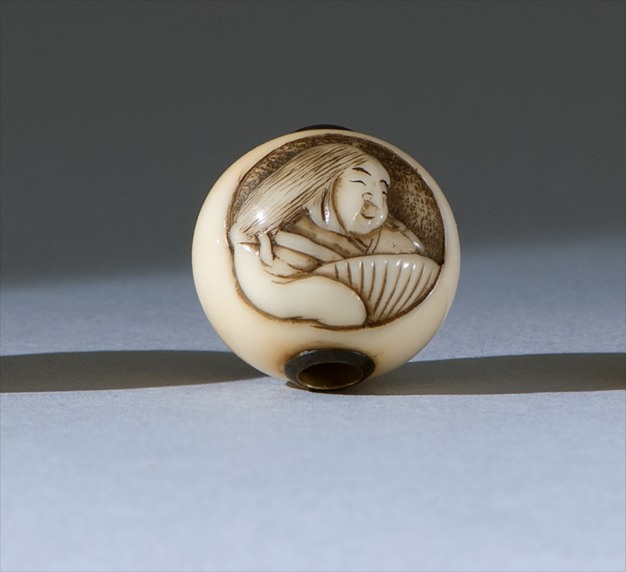 Appraisal: IVORY OJIME th CenturyBy Kokusai In ball form with depicting