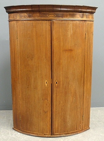 Appraisal: - Georgian inlaid mahogany bow-front hanging corner cupboard h x