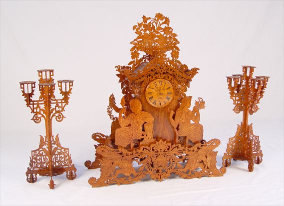 Appraisal: FRETWORK EXHIBITION PIECE FAUX CLOCK GARNITURE SET A fine exhibition