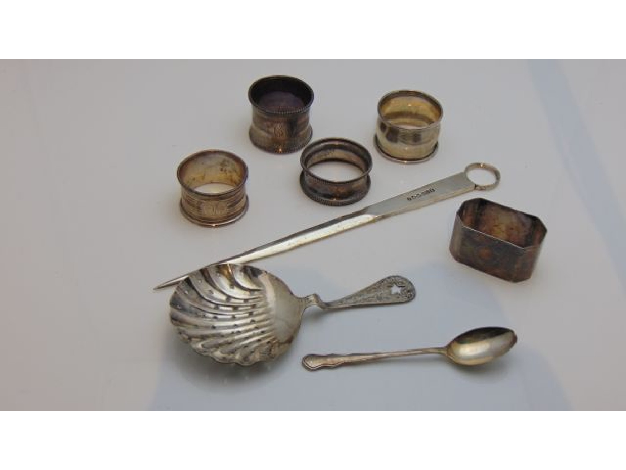 Appraisal: A miscellaneous collection of five silver napkin rings various makers