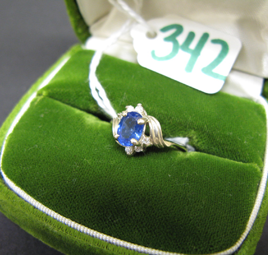 Appraisal: SAPPHIRE DIAMOND AND FOURTEEN KARAT WHITE GOLD RING centering an