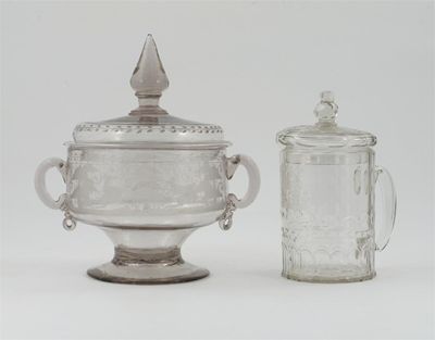 Appraisal: A large glass two-handled bowl and cover each side engraved