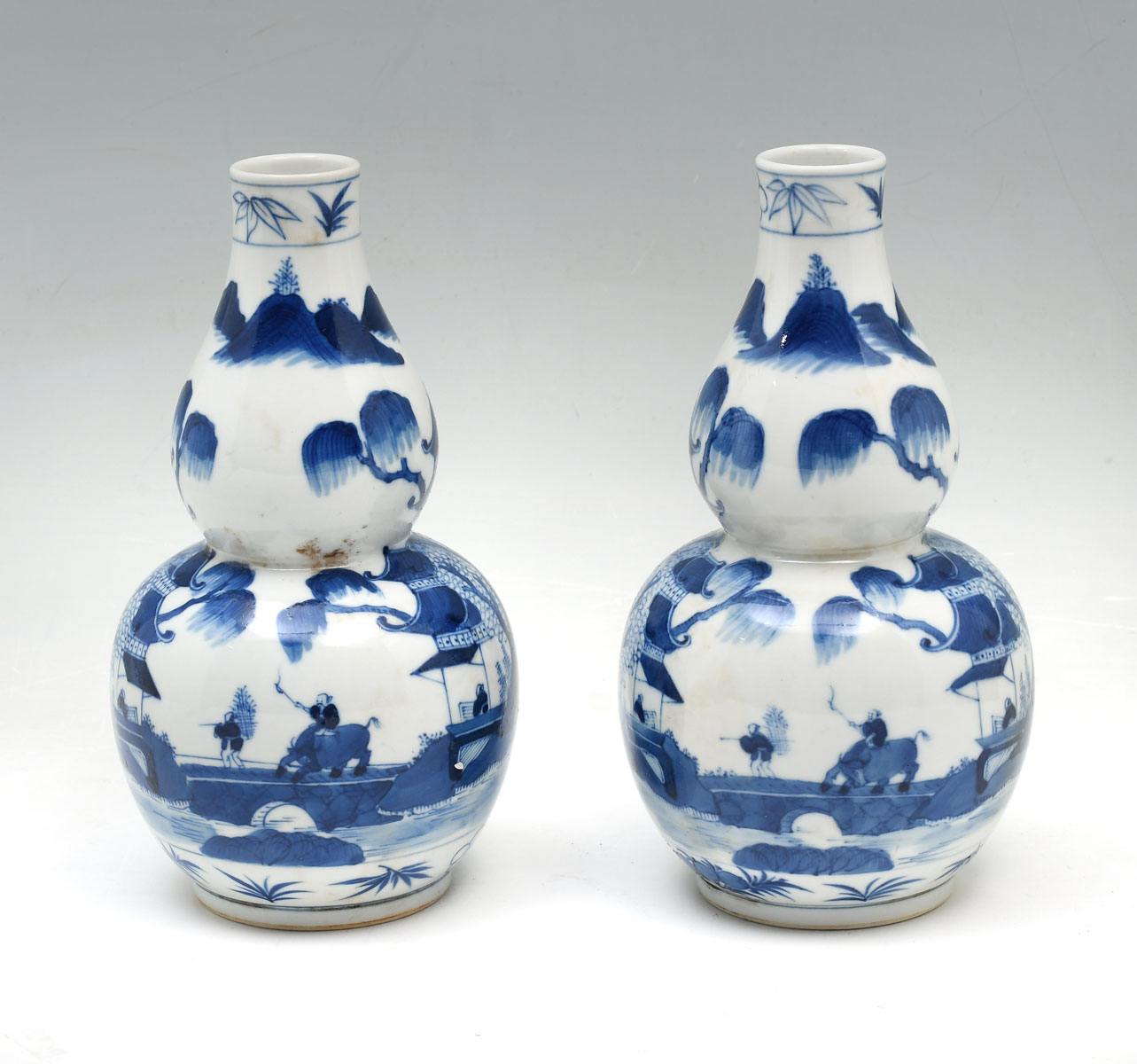 Appraisal: PAIR OPPOSING CHINESE SCENIC DOUBLE GOURD VASES Late th century