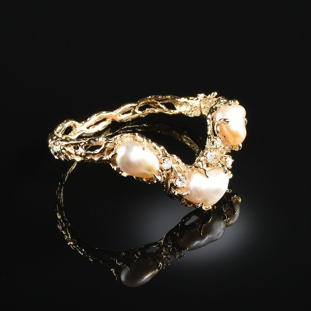 Appraisal: AN ARTHUR KING K YELLOW GOLD DIAMOND AND PEARL BRACELET